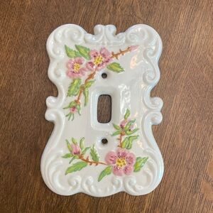 Hand painted ceramic light switch plate.